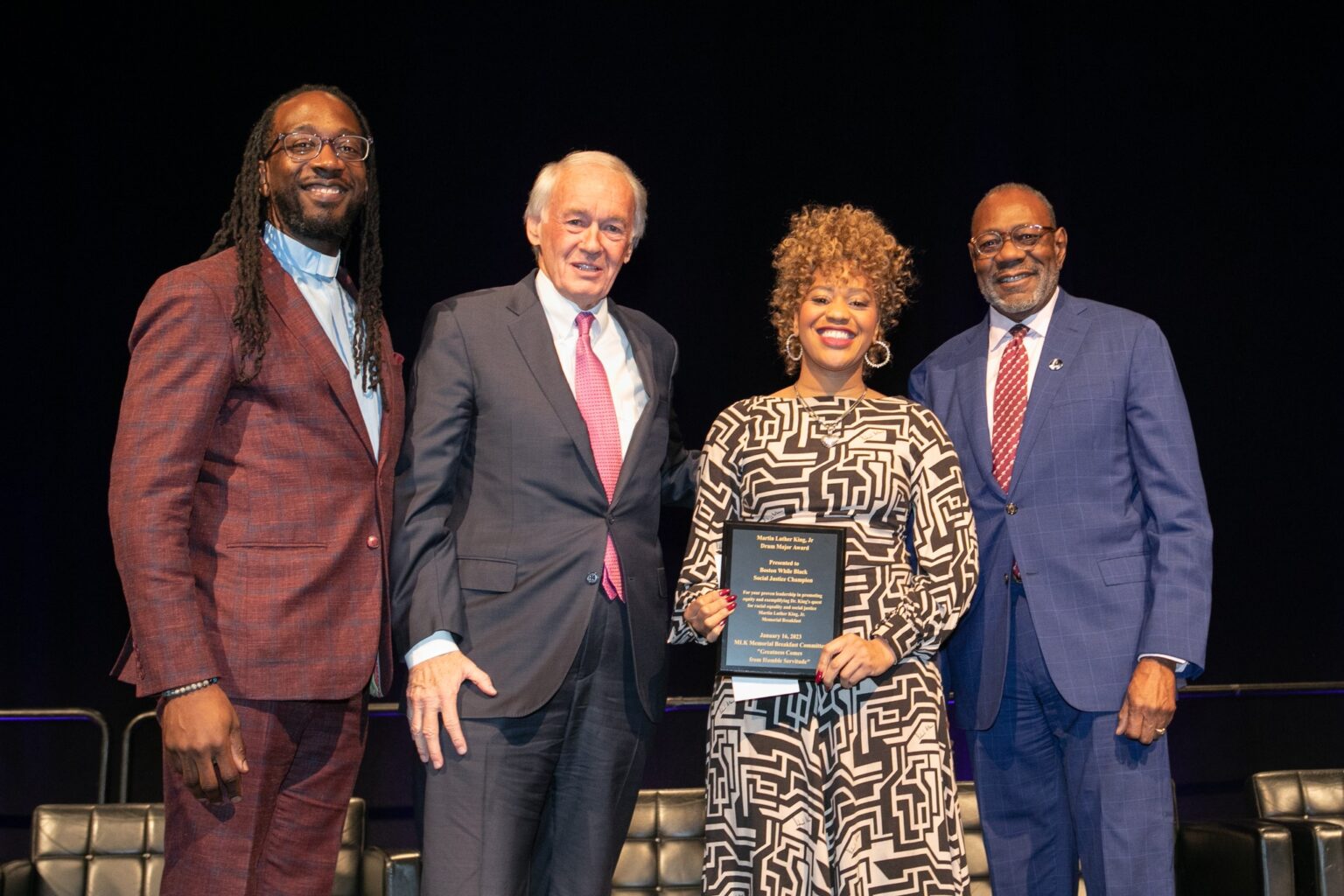 Sheena Collier, representing Boston While Black, accepts the 2023 Drum Major Award with Sen. Ed Markey and MLK Memorial Breakfast Committee Co-Chairs Rev. Dr. Jay Williams and James Dilday, Esq.